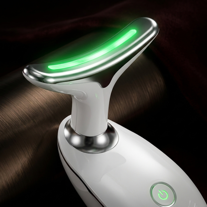 Close-up of EMS face lifting device with green LED light glowing